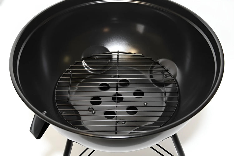Close-up inside of a 19-inch BBQ grill showing the cooking grid and fire bowl 2020