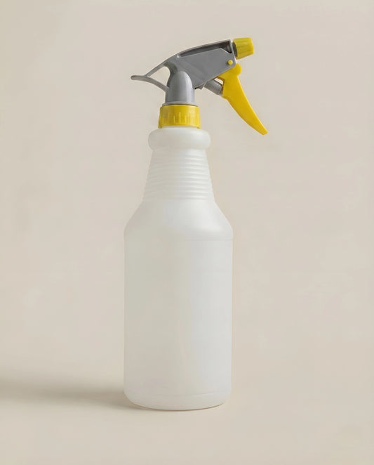 Durable plastic trigger spray bottle with adjustable nozzle head, ergonomic handle, and ribbed neck grip for secure holding.