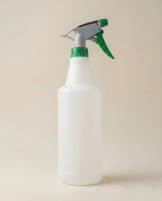 Tall, heavy-duty plastic trigger spray bottle with a ribbed neck grip, adjustable nozzle head, and ergonomic handle for commercial cleaning.