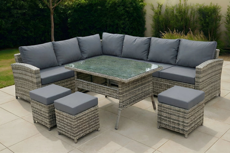 Expansive JHA-18017 9-seater rattan garden furniture set arranged on a patio, featuring an L-shaped wicker corner sofa, dining-height glass table, and three matching stools.