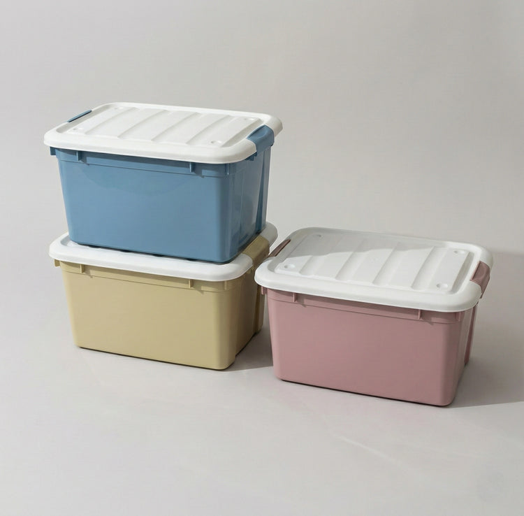 Extra-large 120L stackable plastic storage bins in assorted colors with secure lids for bulk organization.
