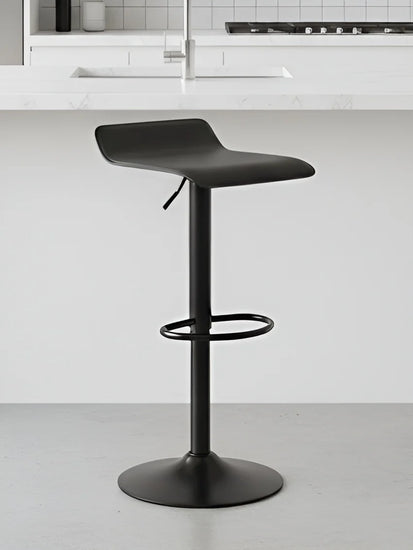 Black adjustable bar stool in a kitchen setting