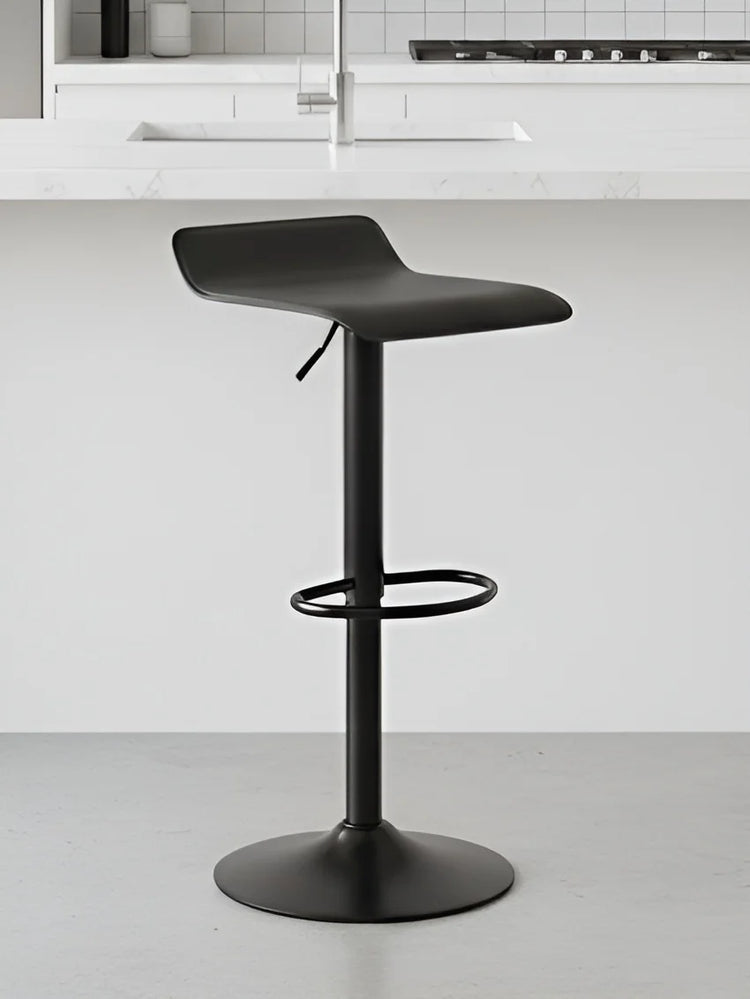 Black adjustable bar stool in a kitchen setting