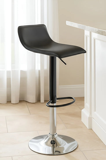 Black bar stool with chrome base in a room with white curtains and a white cabinet.
