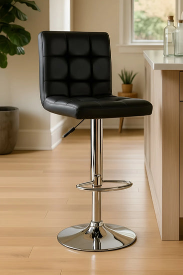 Black bar stool with chrome base in a kitchen setting