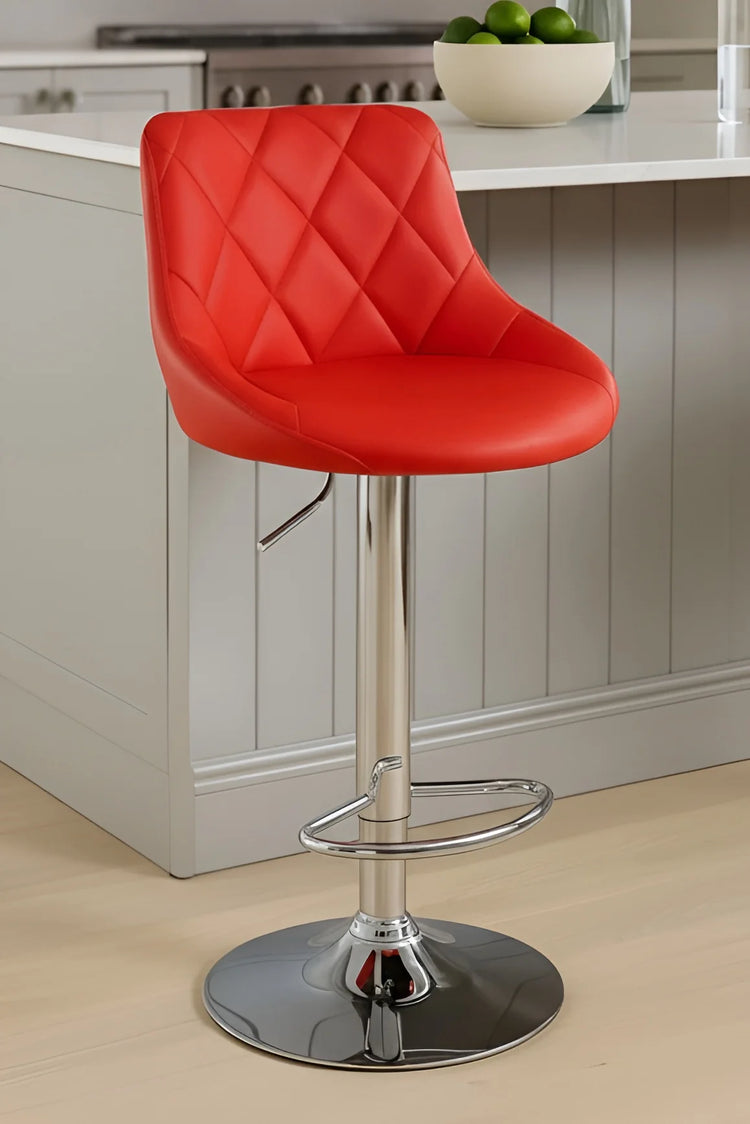 Red bar stool with a quilted design in a kitchen setting