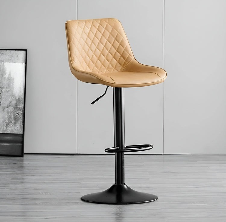 Beige quilted bar stool with black base on a gray floor.