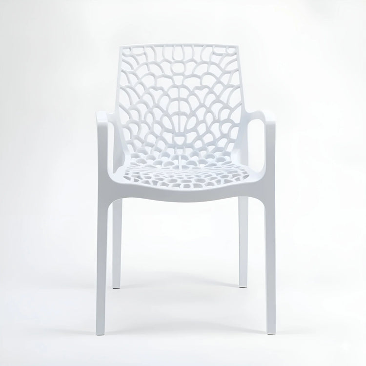 Frontal view of a stackable white indoor/outdoor plastic chair with arms and a spiderweb design YH-675