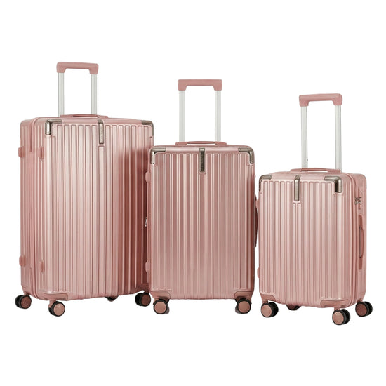 Set of three rose gold suitcases on a white background