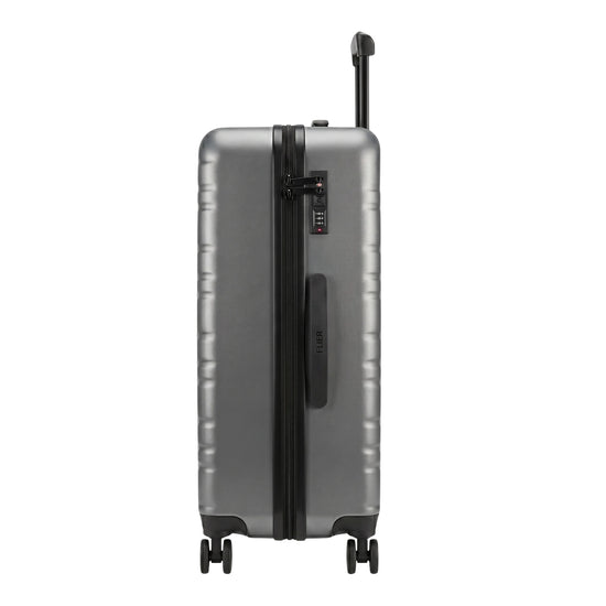 FLIEGER 8844 3pc hard shell suitcase set in black, navy, champagne, and grey featuring 360 degree mobility and lightweight spinner design.