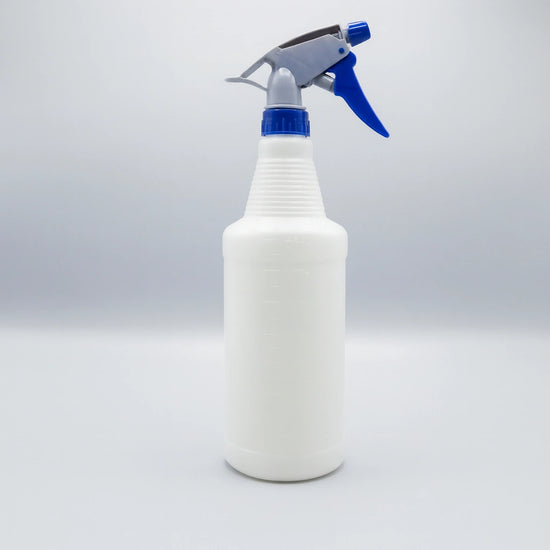 Large 800mL heavy-duty plastic trigger spray bottle with molded dilution ratio scales, ribbed neck grip, and adjustable nozzle for professional cleaning.