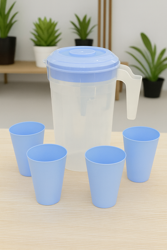 Translucent plastic water jug with light blue lid and four matching blue cups arranged on a wooden table, product code 8653 DD1162.