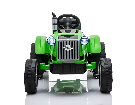 Green toy tractor on a white background