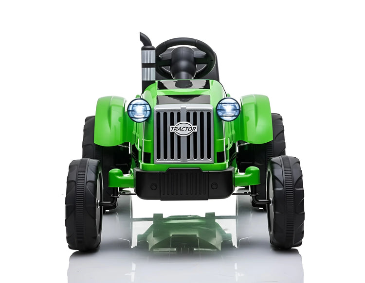 Green toy tractor on a white background