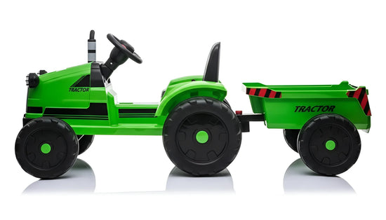 Green toy tractor with a trailer on a white background