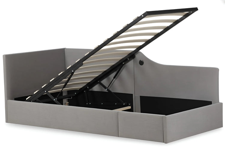 Grey upholstered single gas lift storage bed frame with the mattress base lifted, revealing a large storage space underneath 4469-3GU