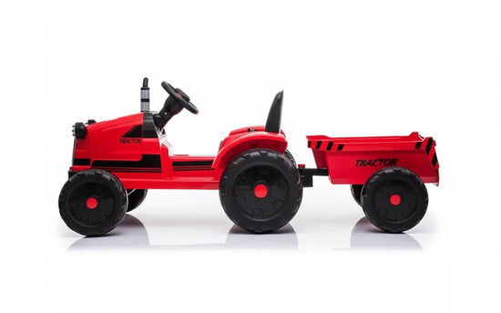 Red toy tractor with a trailer on a white background