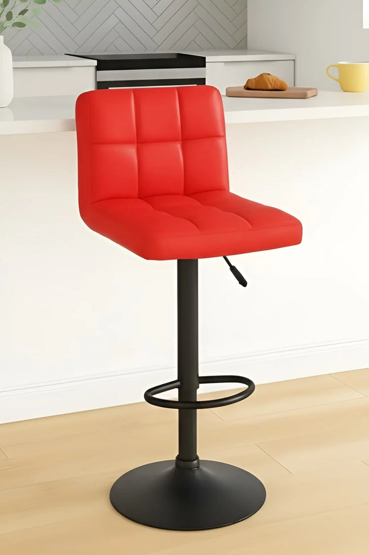Red bar stool with black base on a light wood floor.