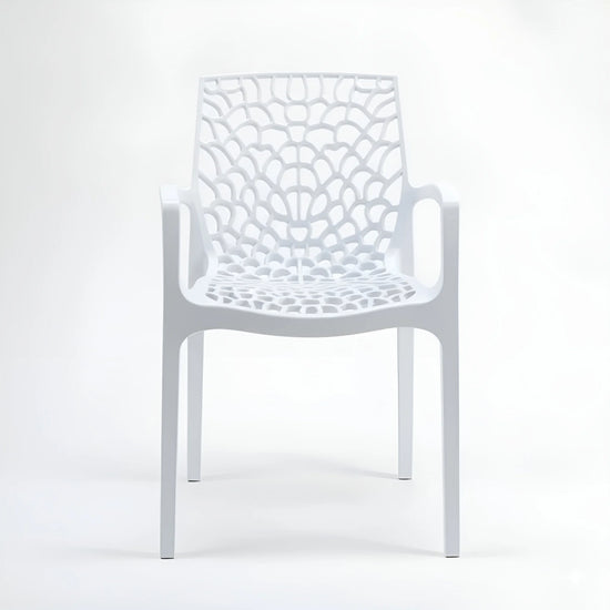 Frontal view of a stackable white indoor/outdoor plastic chair with arms and a spiderweb design YH-675