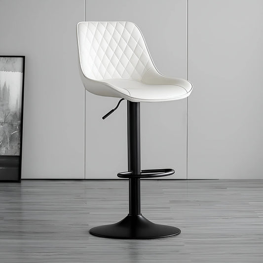 White quilted chair with black base on a gray floor and wall background