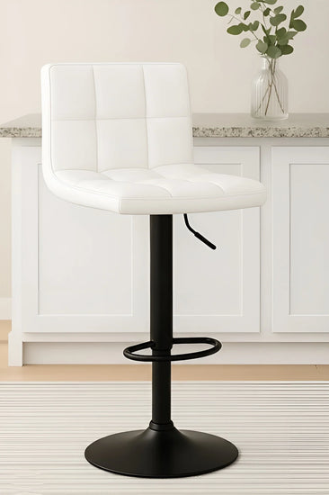 White bar stool with black base in a kitchen setting