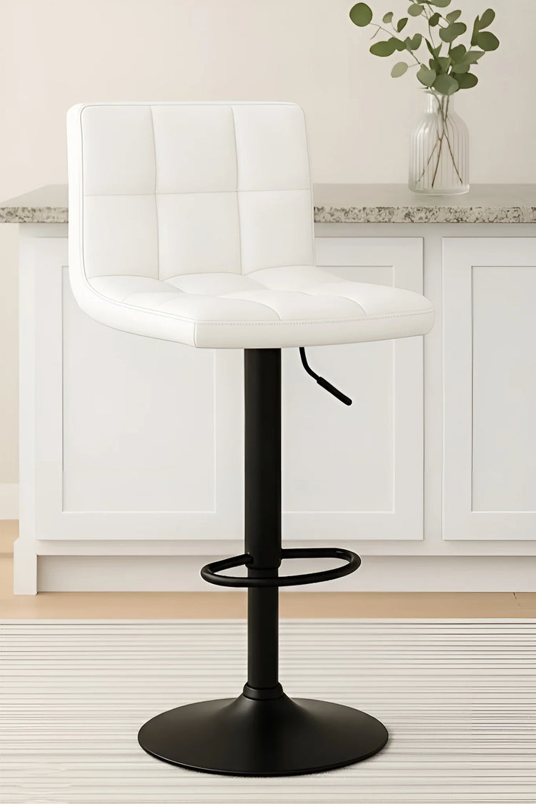 White bar stool with black base in a kitchen setting