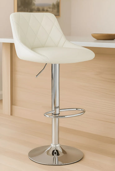 White bar stool with quilted design on a wooden floor